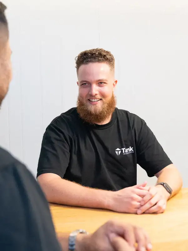 Business professionals shaking hands outside modern glass office building confirming professional services agreement