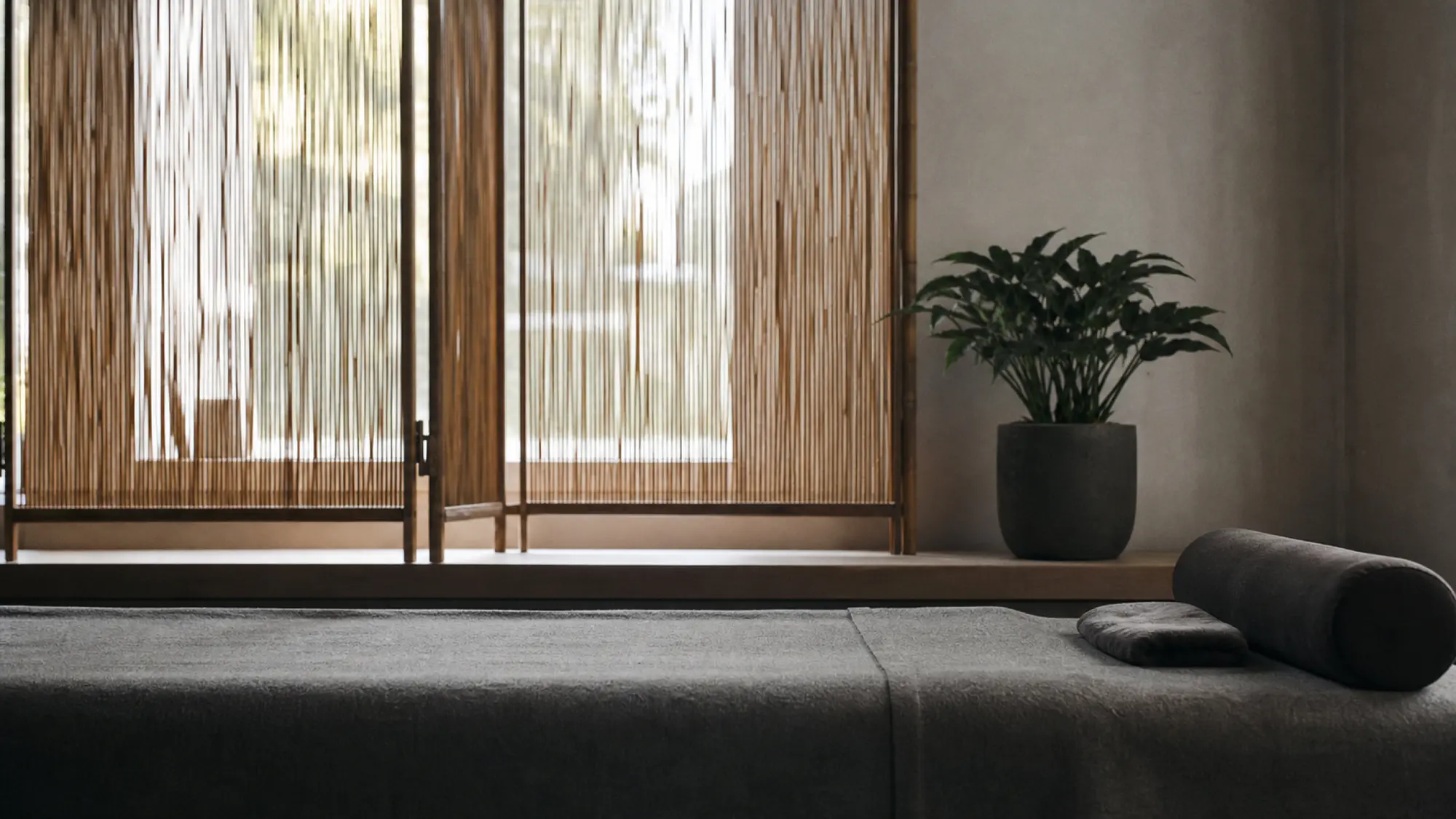 Calm acupuncture clinic bench with bamboo screen, acupuncturist professional indemnity insurance quote