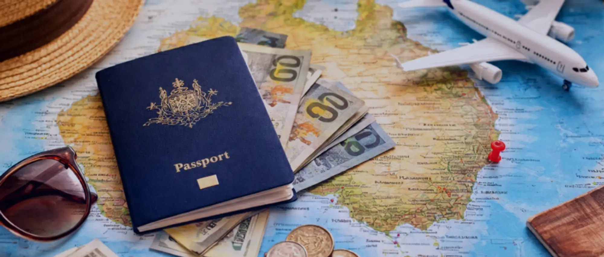 Australian passport with travel documents currency and map representing travel agent booking services and client protection