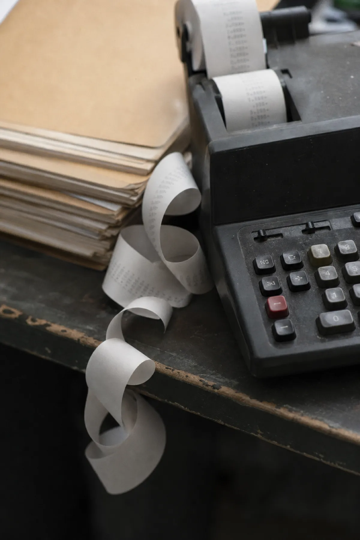 Adding machine with curled paper tape, professional indemnity cover for bookkeepers