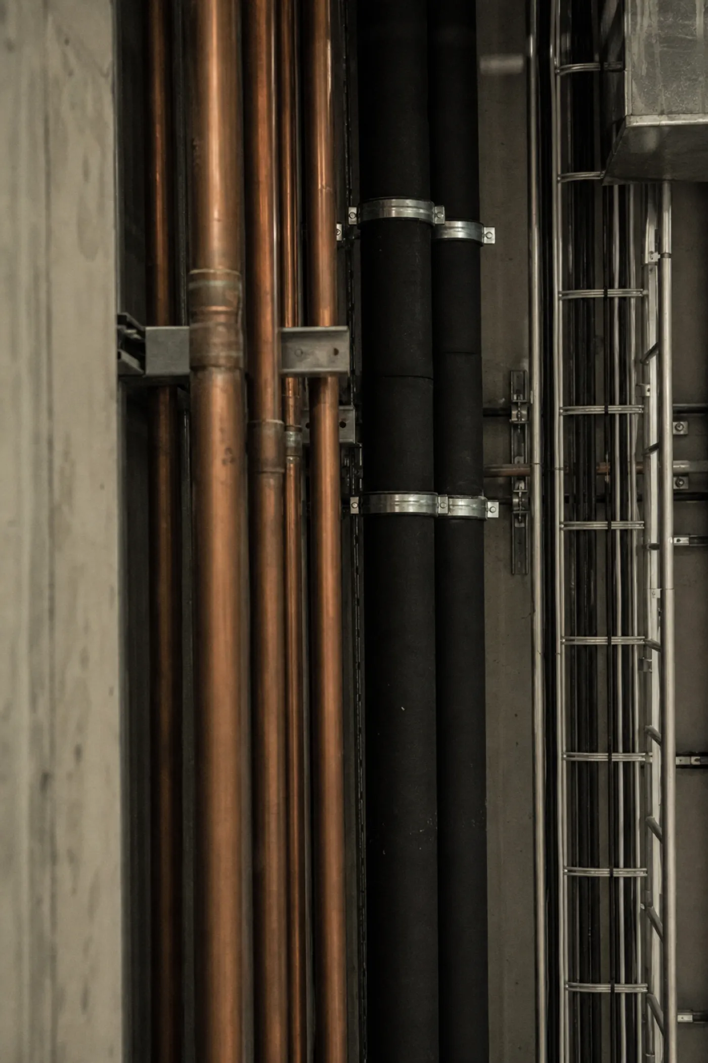 Building services riser with pipes and cable ladder - PI cover for services engineers