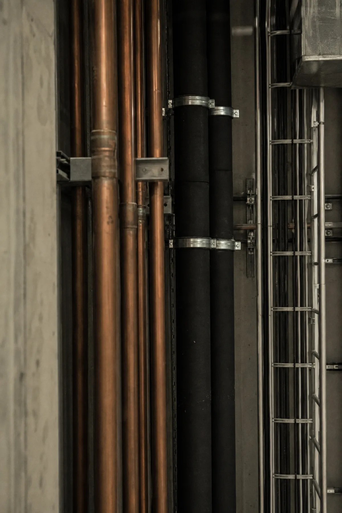 Building services riser with pipes and cable ladder - PI cover for services engineers