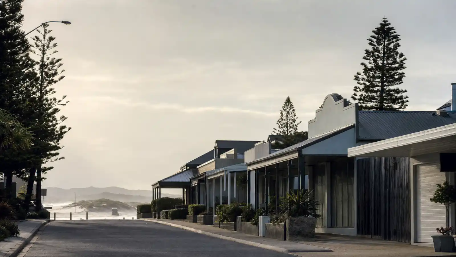 Coastal town shopfronts near the beach, insurance brokers for Central Coast businesses