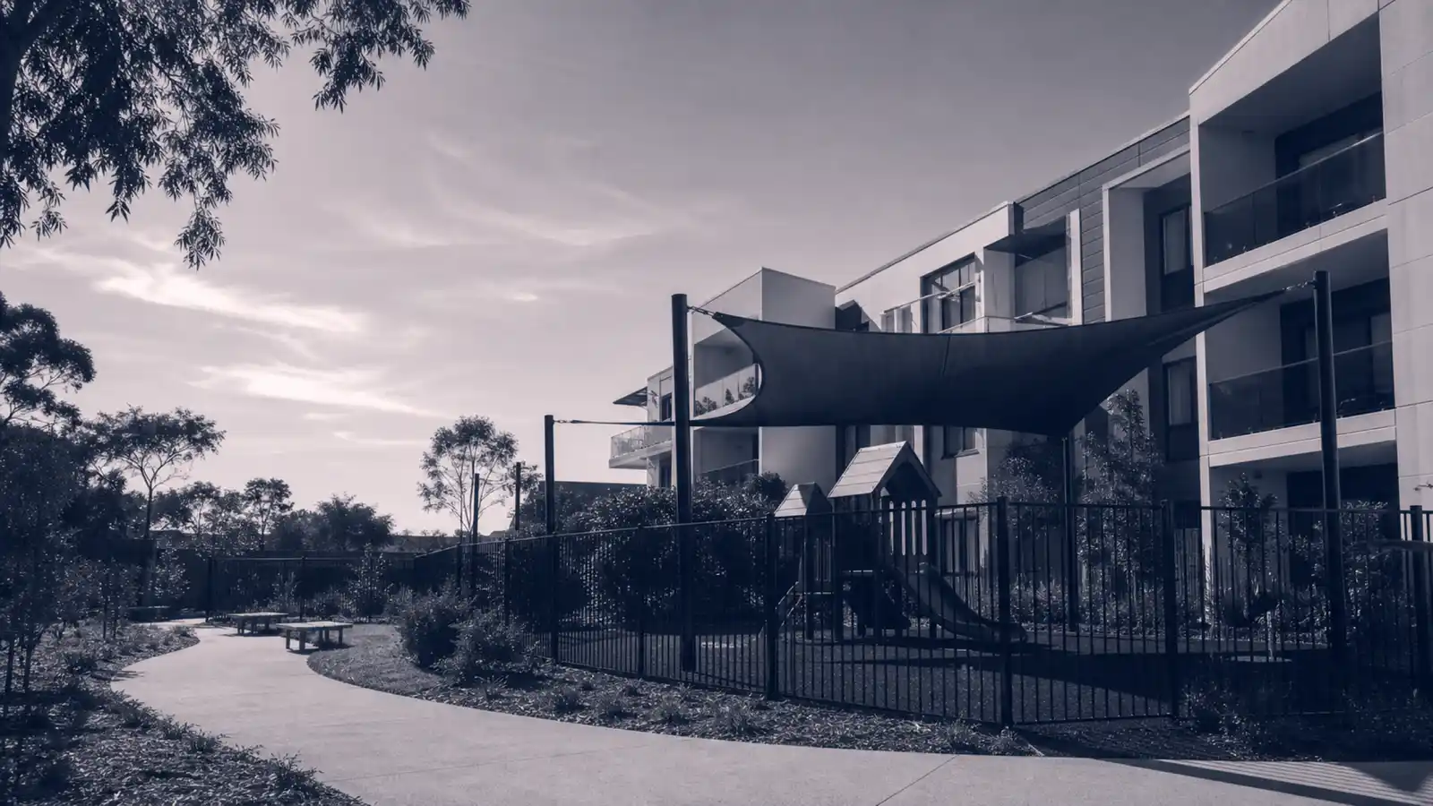 Strata building with fenced childcare play area, childcare centre strata insurance