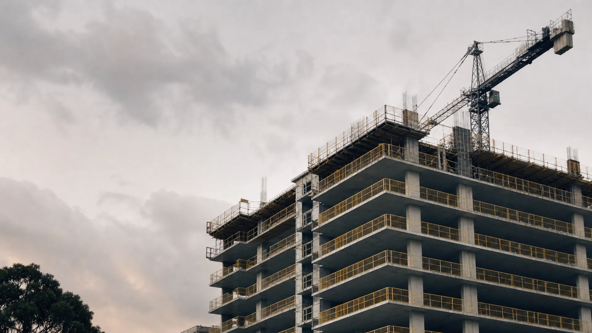 Mid-rise concrete structure with tower crane - contract works insurance for commercial builders