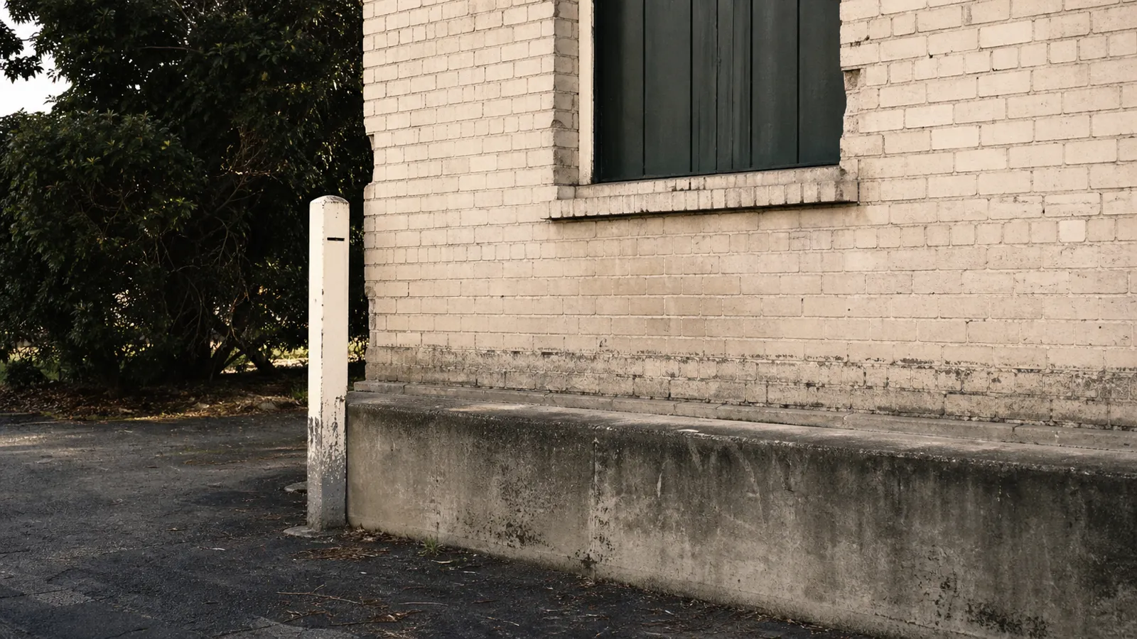 Historic flood waterline on a brick warehouse wall, why flood-zone commercial property gets declined