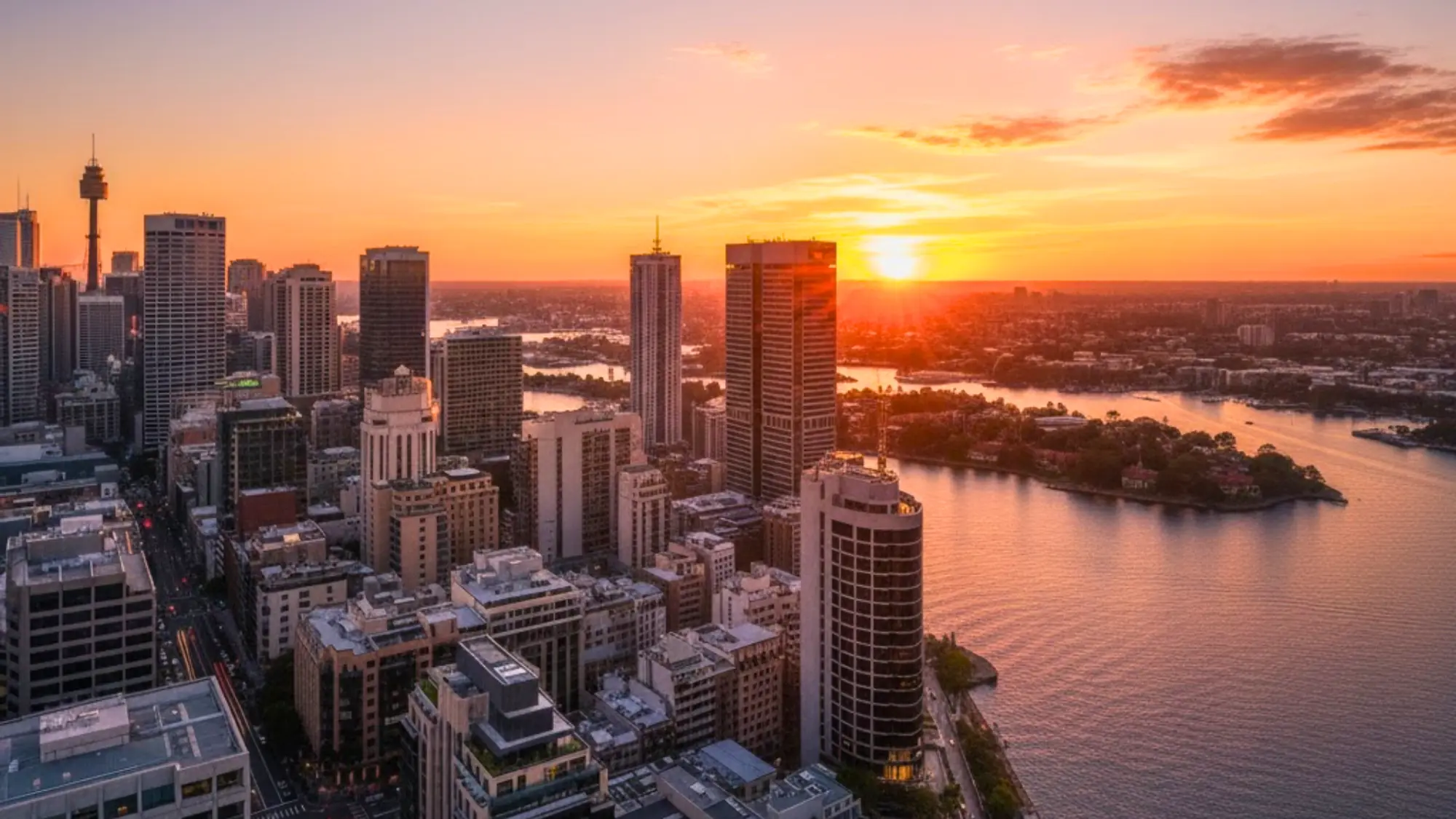 Commercial skyscrapers in Australia at sunset representing high-value property portfolios requiring ISR coverage