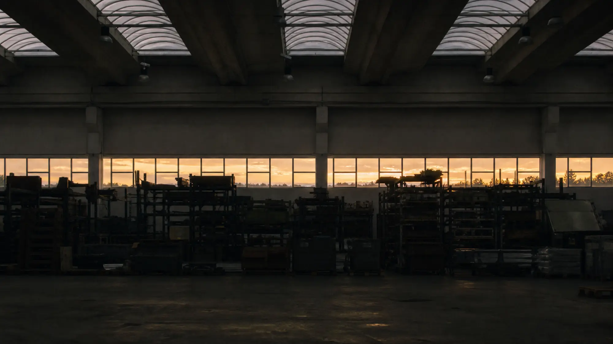 Factory floor and racking at dusk - insurance for industrial engineering consultants