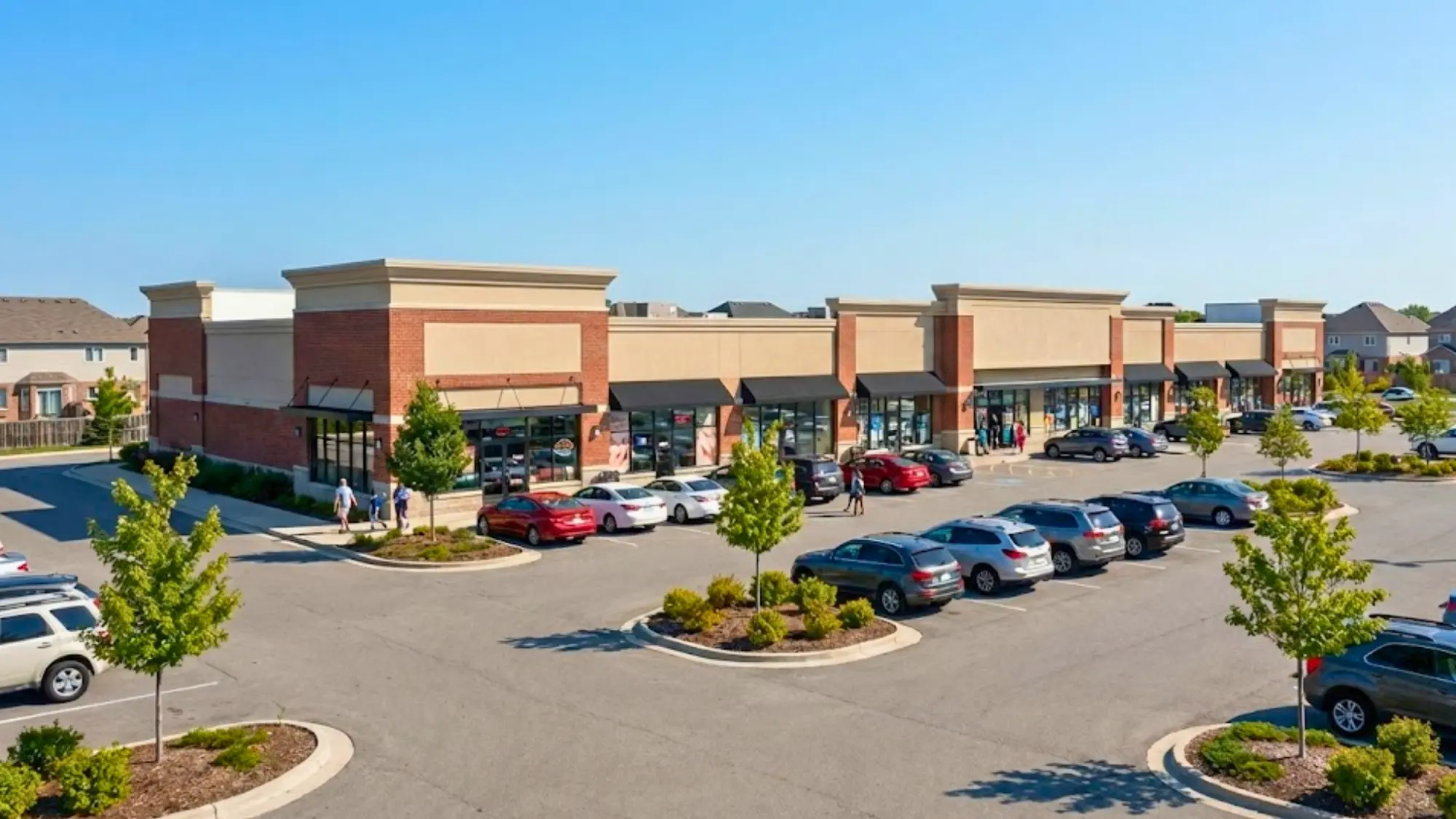 Suburban strip mall with a busy parking lot