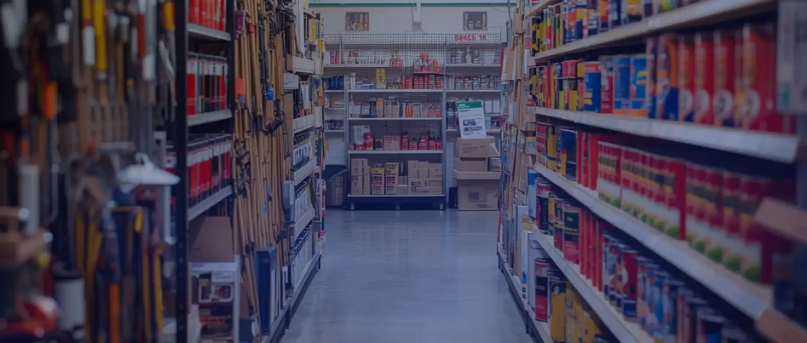 Trade counter and workshop area inside a hardware store filled with power tools, machinery, and industrial equipment requiring comprehensive asset protection insurance