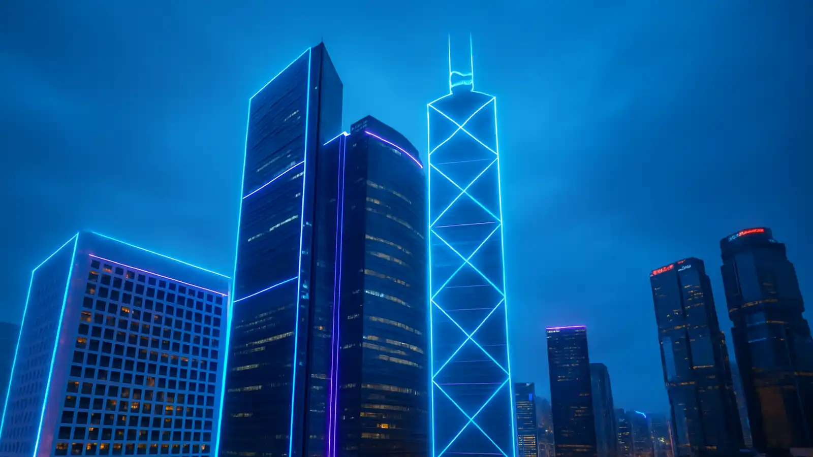 Illuminated modern commercial skyscrapers representing high-value properties requiring ISR insurance coverage