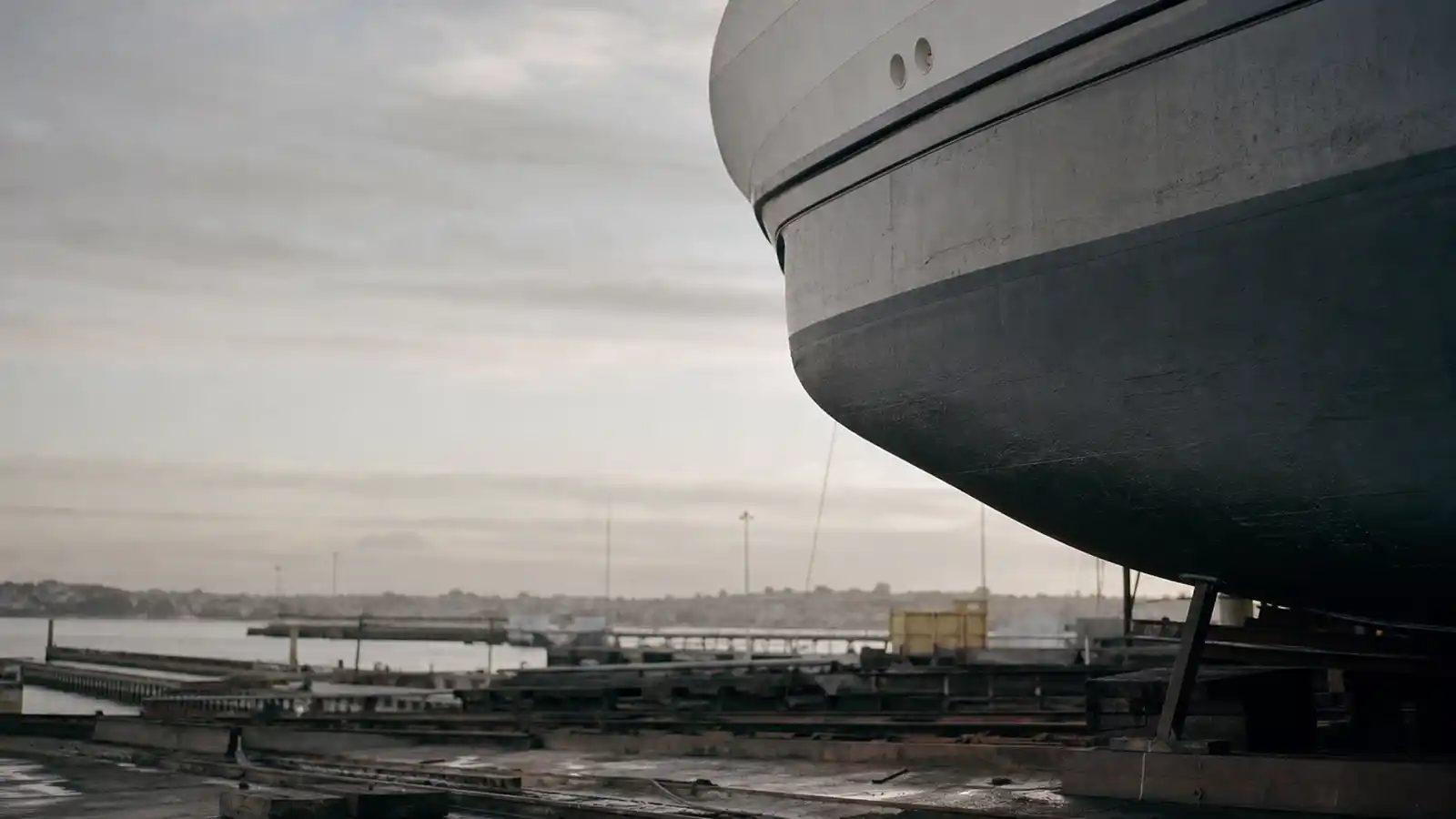 Vessel hull on hardstand at a shipyard - marine engineer insurance