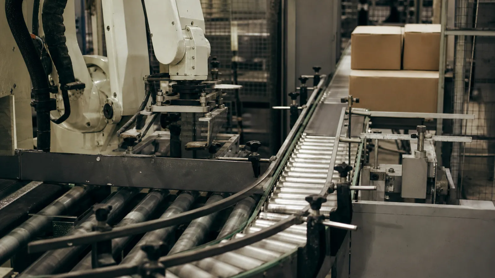 Conveyor and robotic arm on a production line - manufacturing process engineering risk