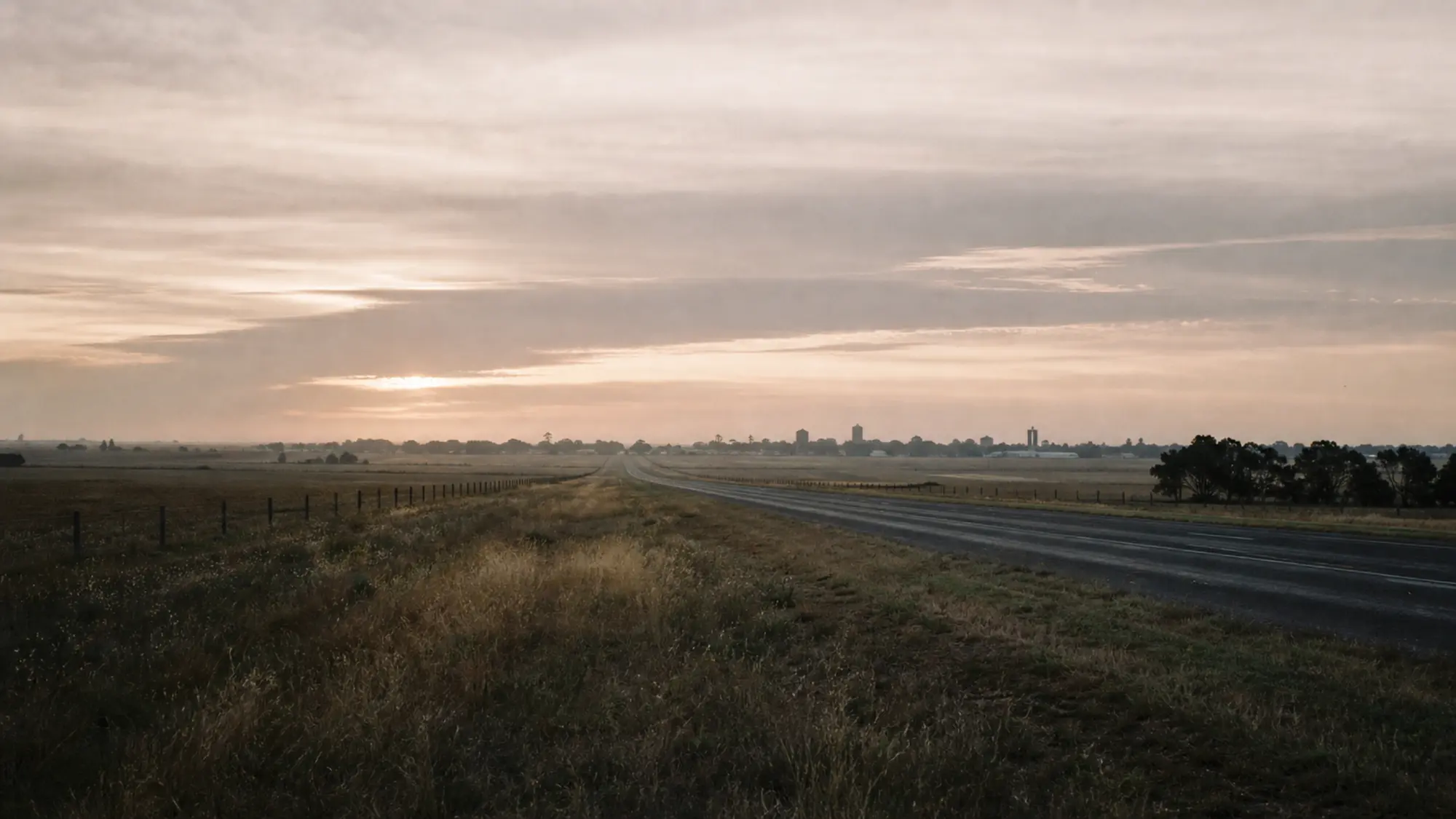 Regional Australian highway at dawn, Tank Insurance services clients Australia-wide