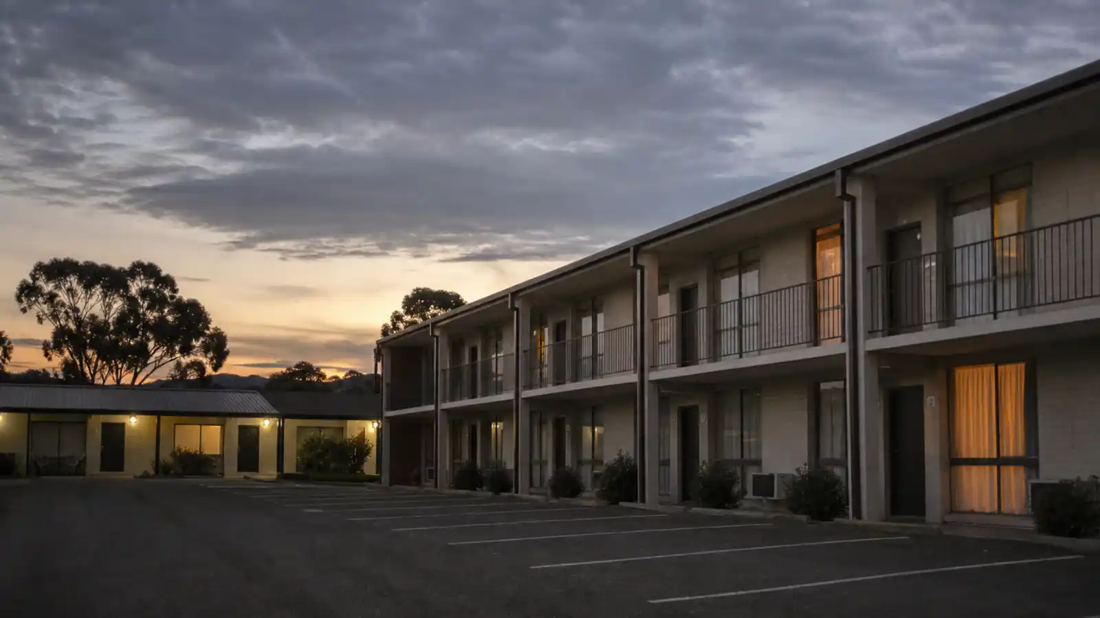 Australian motel courtyard at dusk, accommodation property covered by ISR insurance for hotels and motels