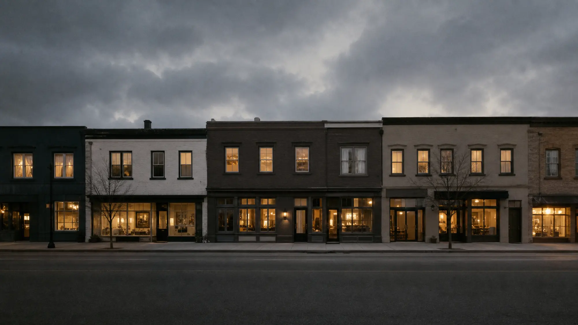 Mixed-use street at dusk with shops and apartments lit, properties insured under ISR