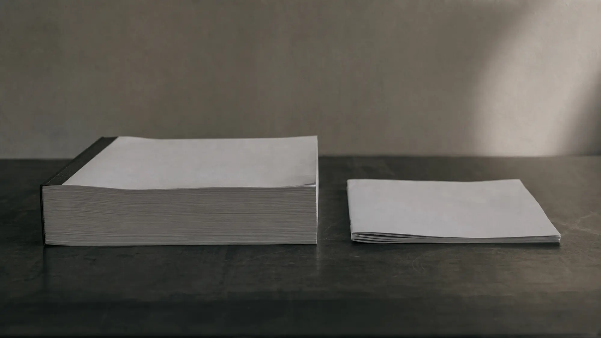 Thick ISR policy beside a slim business pack booklet, comparing ISR vs business pack cover