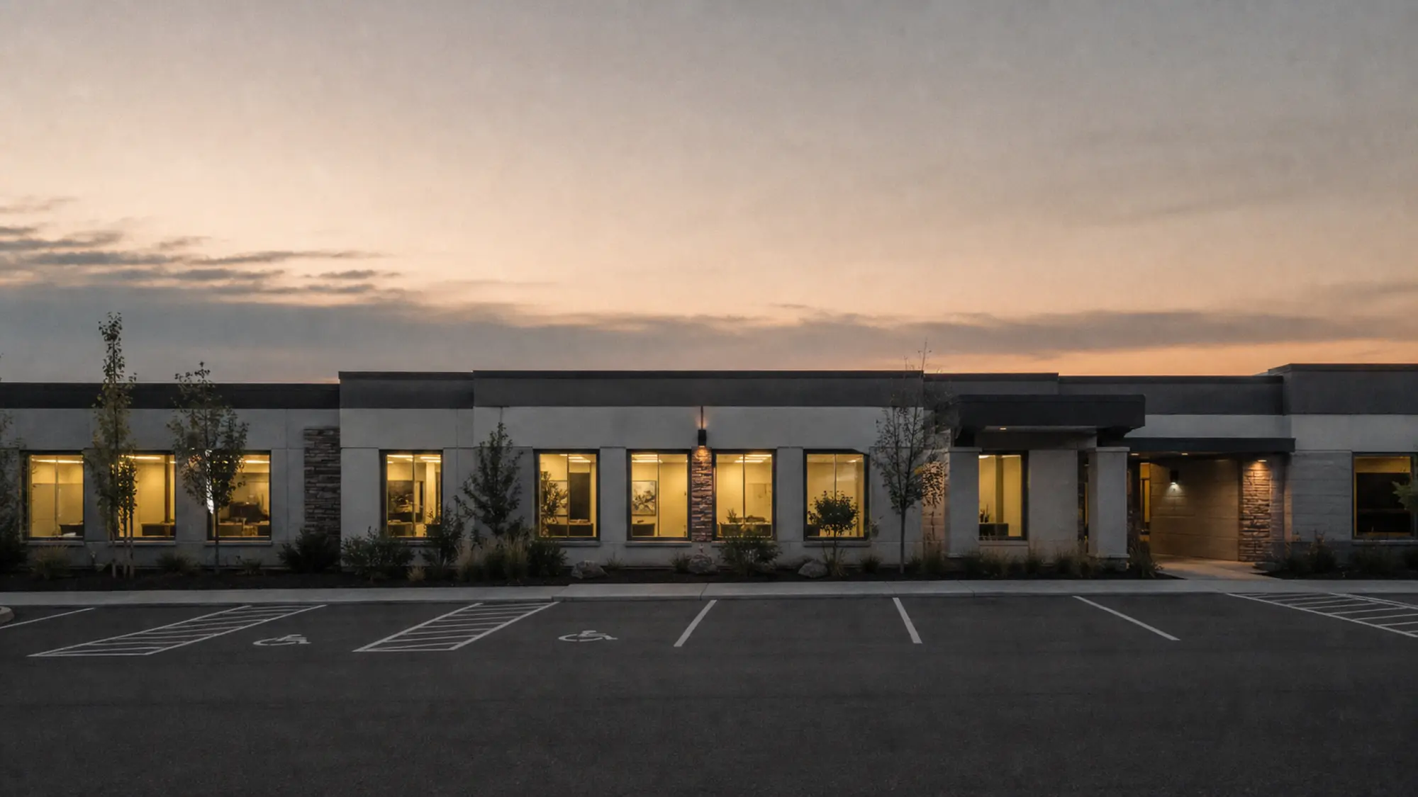 Medical centre strata building at dusk, get a healthcare strata insurance quote