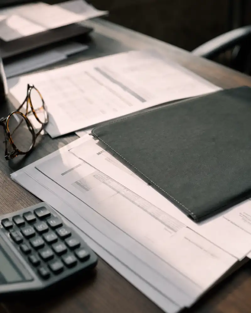 Policy schedules on a desk during a medical practice insurance review