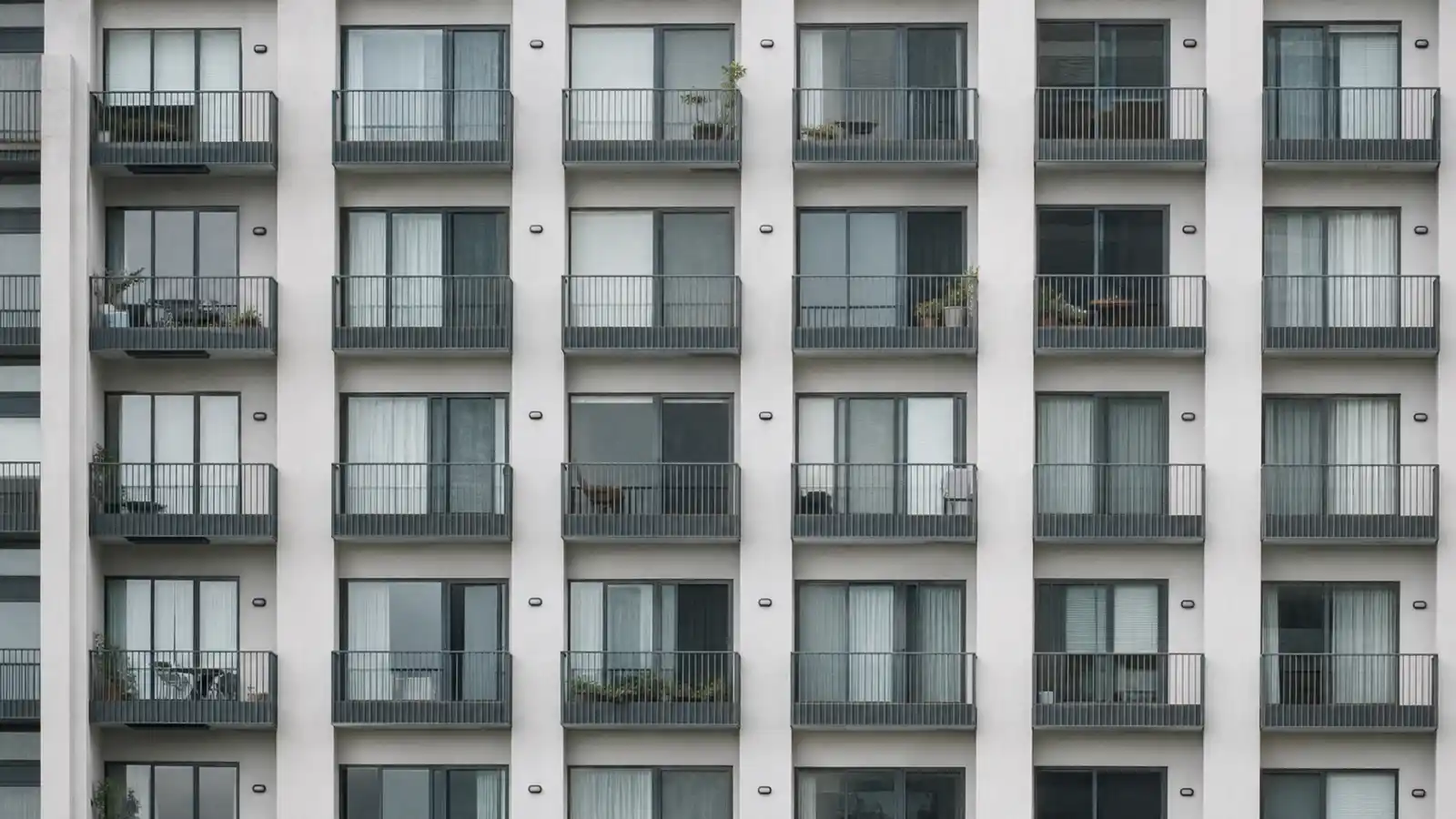 Repeating apartment facade grid illustrating multi dwelling insurance cost
