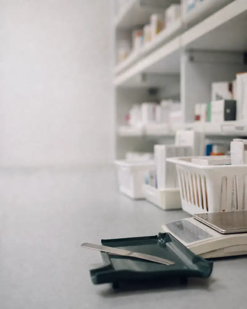 Dispensing bench with counting tray and prescription baskets - clinical risk covered by pharmacy insurance