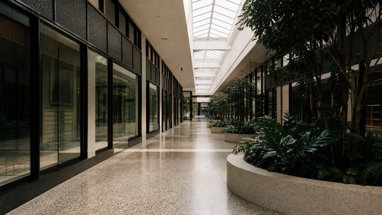 Covered arcade walkway between strata shopfronts, common property in a retail strata scheme