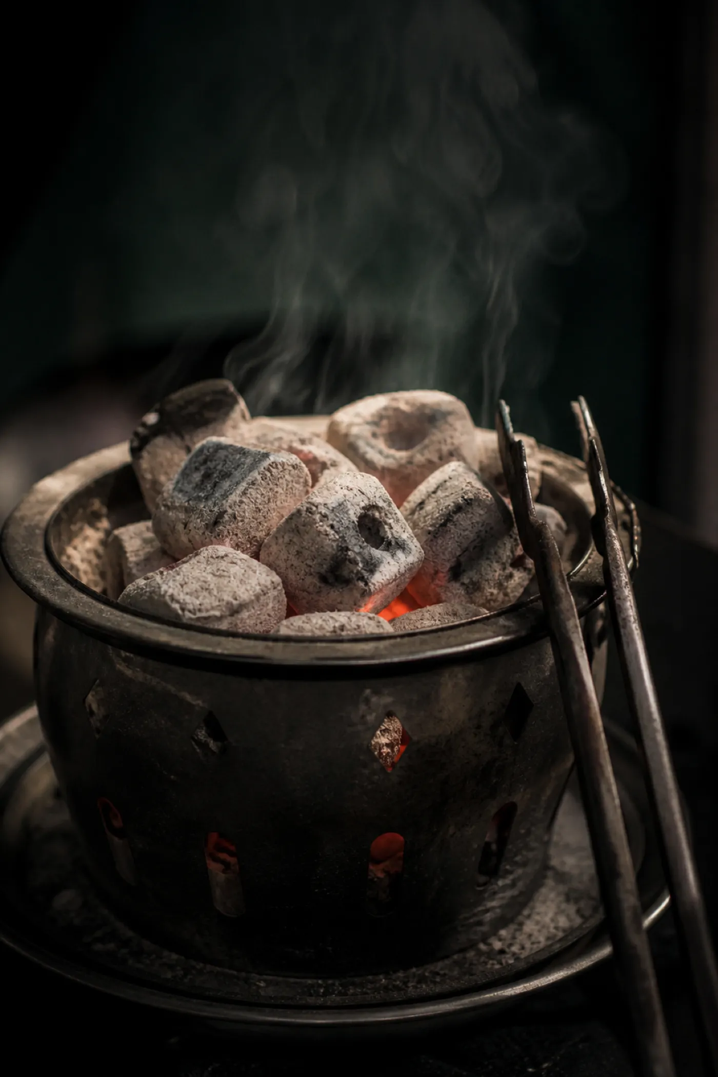 Hot charcoal in a heating basket, the fire risk shisha lounge insurance addresses