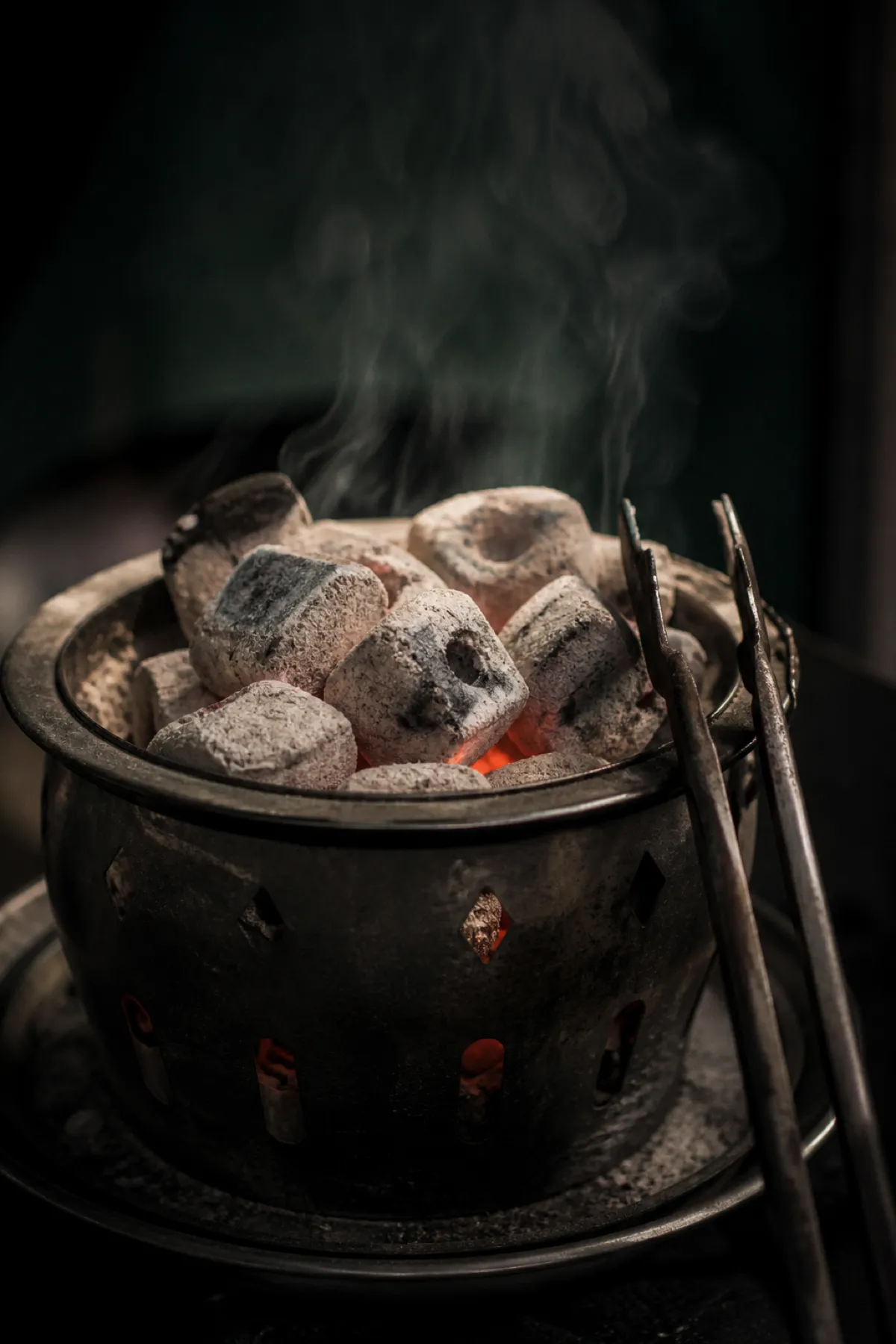 Hot charcoal in a heating basket, the fire risk shisha lounge insurance addresses