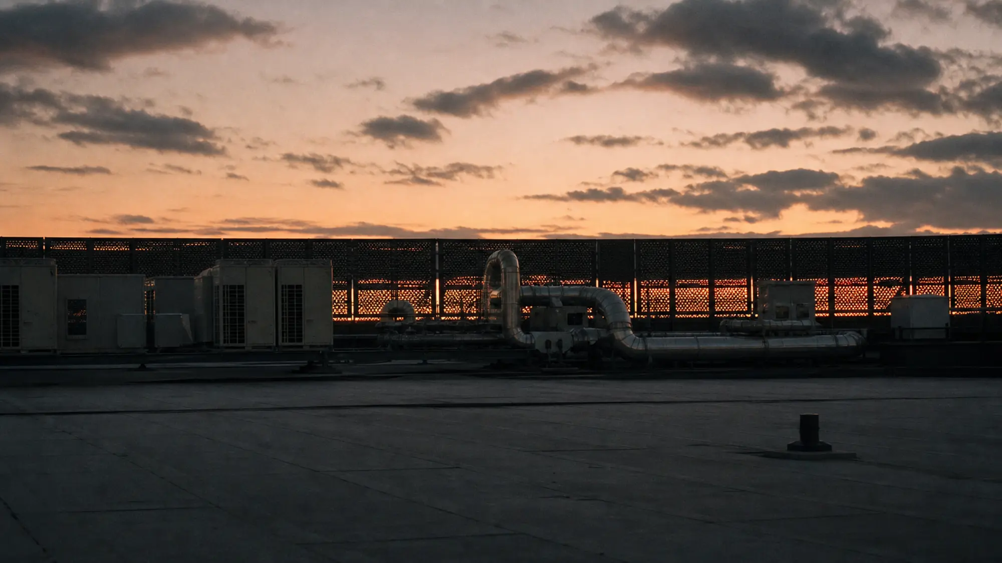 Rooftop building plant at dusk, get a strata machinery breakdown insurance quote
