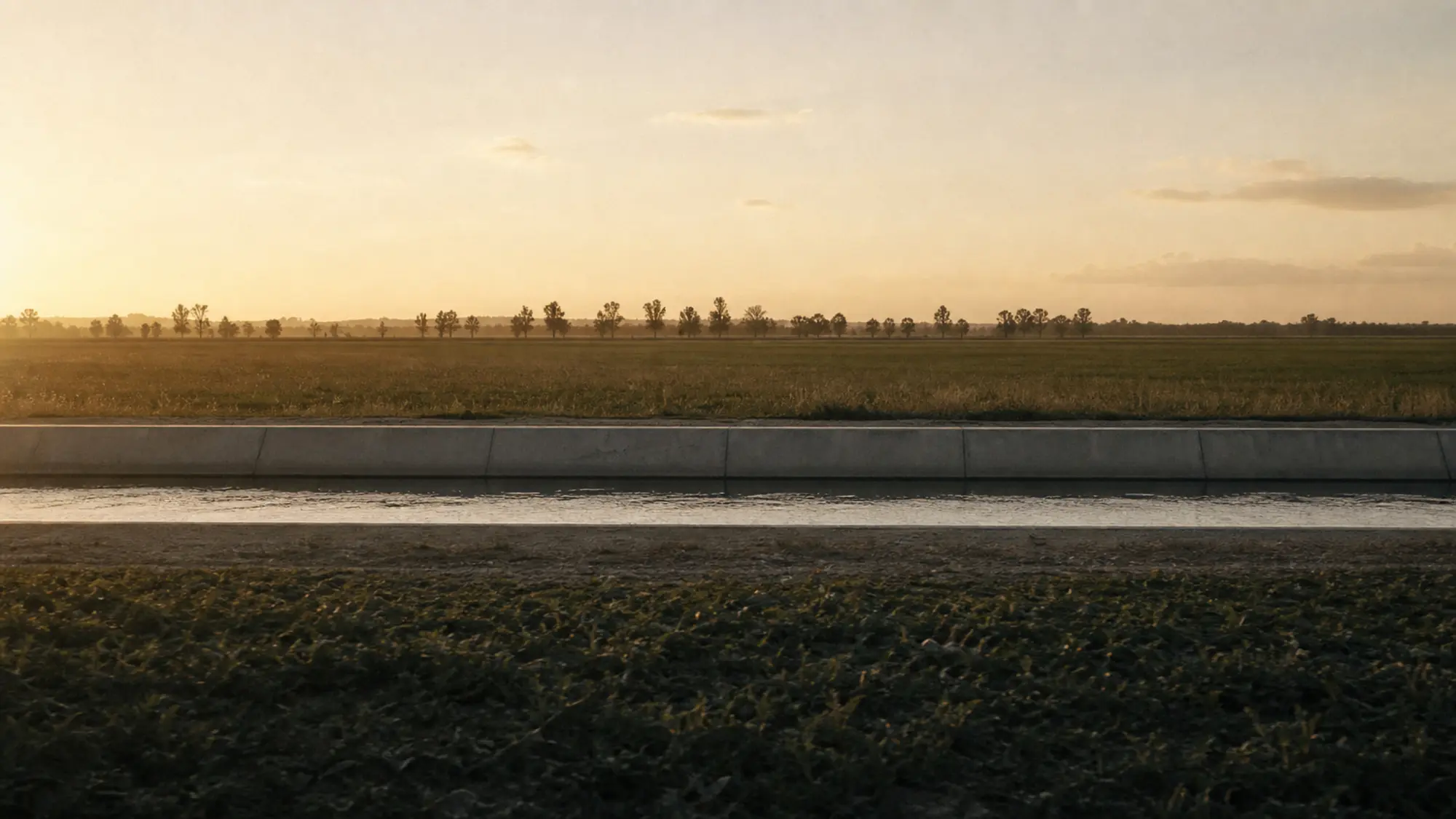 Concrete irrigation channel at golden hour - water engineer insurance quote